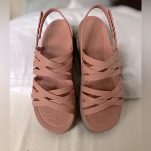 Women’s Crocs Brooklyn Strappy low wedge dusty rose in color